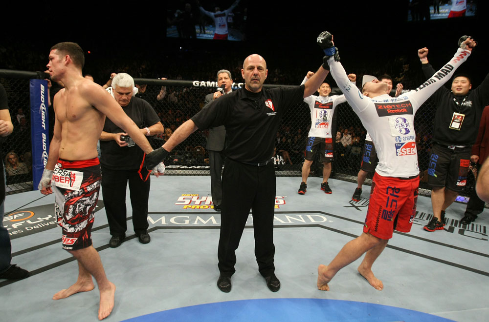 Dong Hyun Kim celebrates his win over Nate Diaz at UFC 125