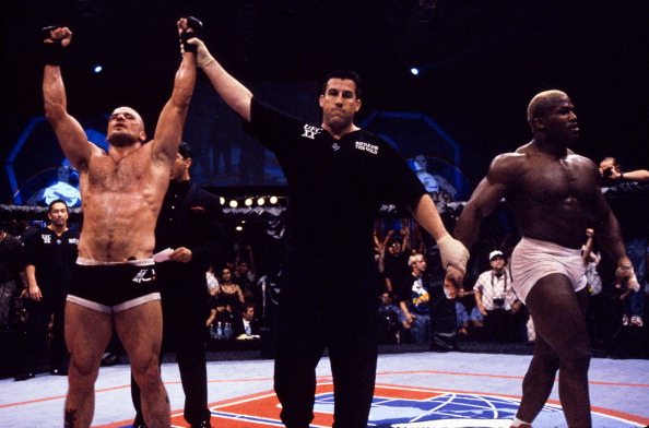 Bas Rutten (L) wins a controversial decision over Kevin Randleman (R) to capture the UFC Heavyweight Championship at the Boutwell Auditorium on May 7, 1999 in Birmingham, AL. (Photo by Susumu Nagao/Zuffa LLC)