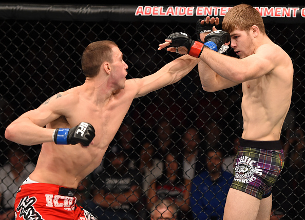 (L-R) James Vick punches Jake Matthews in their bout during the UFC Fight Night event on May 10, 2015 in Australia. (Photo by Josh Hedges/Zuffa LLC)