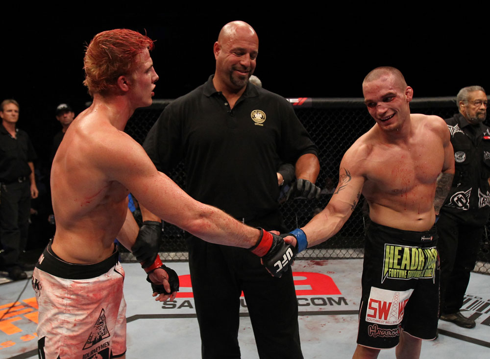 Lance Benoist (right) shakes hands with Matt Riddle