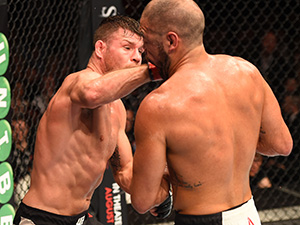 (L-R) Michael Bisping of England punches Thales Leites of Brazil in their middleweight fight during the UFC Fight Night event inside the SSE Hydro on July 18, 2015 in Glasgow, Scotland. (Photo by Josh Hedges/Zuffa LLC)