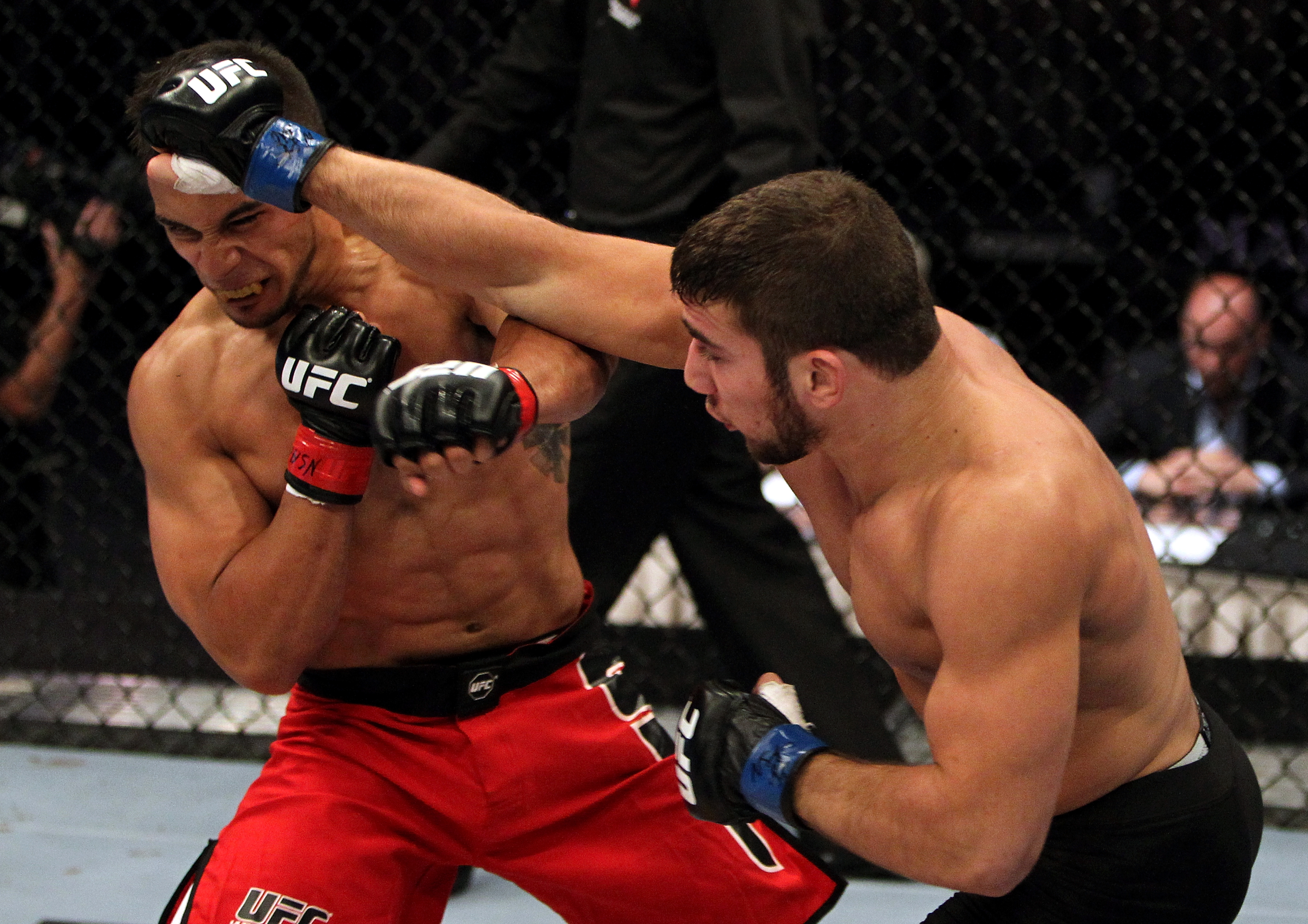 (R-L) Jimmie Rivera punches Dennis Bermudez during their Featherweight bout at the TUF 14 Elimination fights inside the Mandalay Bay Events Center on June 7, 2011 in Las Vegas, Nevada. (Photo by Josh Hedges/Zuffa LLC)