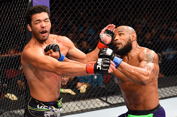 (R-L) Yoel Romero of Cuba punches Lyoto Machida of Brazil in their middleweight during the UFC Fight Night event at the Hard Rock Live on June 27, 2015 in Hollywood, Florida. (Photo by Josh Hedges/Zuffa LLC via Getty Images)