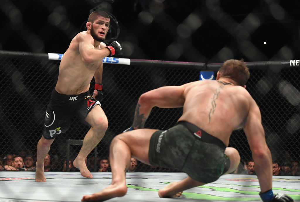 LAS VEGAS, NV - OCTOBER 06: <a href='../fighter/Khabib-Nurmagomedov'>Khabib Nurmagomedov</a> of Russia (L) chases down <a href='../fighter/Conor-McGregor'>Conor McGregor</a> of Ireland in their UFC lightweight championship bout during the UFC 229 event inside T-Mobile Arena on October 6, 2018 in Las Vegas, Nevada. (Photo by Harry How/Getty Images)