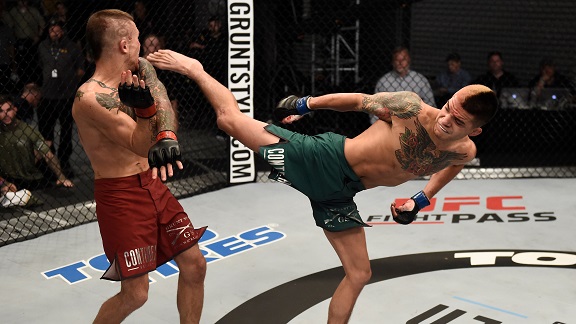 LAS VEGAS, NV - AUGUST 22: (R-L) Benito Lopez kicks Steven Peterson in their bantamweight bout during Dana White's Tuesday Night Contender Series at the TUF Gym on August 22, 2017 in Las Vegas, Nevada. (Photo by Brandon Magnus/DWTNCS)