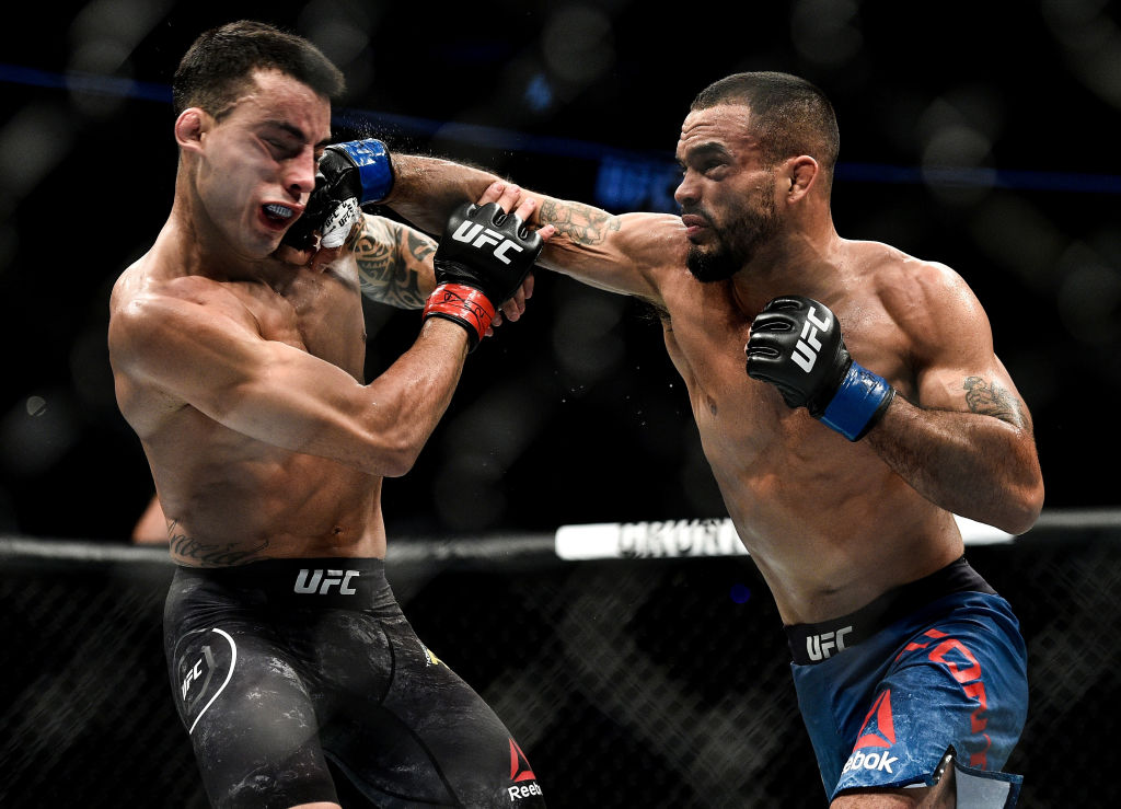 Rob Font punches Thomas Almeida during UFC 220 in Boston, MA. (Photo by Brandon Magnus/Zuffa LLC)