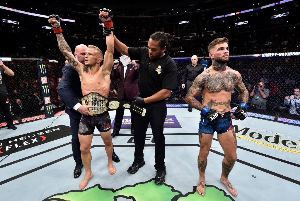 LOS ANGELES, CA - AUGUST 04: TJ Dillashaw celebrates after his knockout victory over Cody Garbrandt in their UFC bantamweight championship fight during the UFC 227 event inside Staples Center on August 4, 2018 in Los Angeles, California. (Photo by Jeff Bottari/Zuffa LLC via Getty Images)