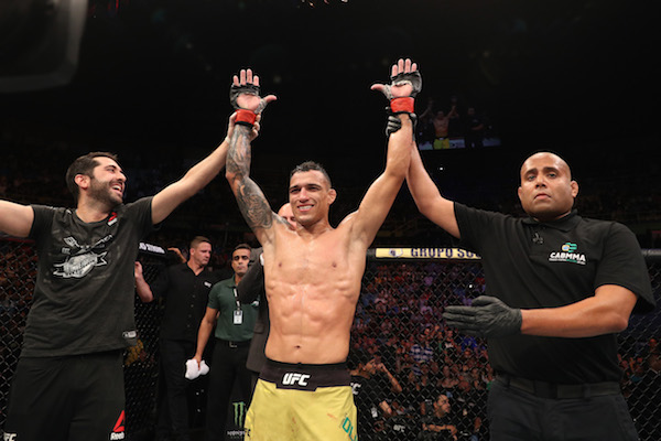 SAO PAULO, BRAZIL - SEPTEMBER 22: <a href='../fighter/charles-oliveira'>Charles Oliveira</a> of Brazil reacts after submitting <a href='../fighter/christos-giagos'>Christos Giagos</a> in their lightweight bout during the <a href='../event/UFC-Silva-vs-Irvin'>UFC Fight Night </a>event at Ibirapuera Gymnasium on September 22, 2018 in Sao Paulo, Brazil. (Photo by Buda Mendes/Zuffa LLC/Zuffa LLC via Getty Images)