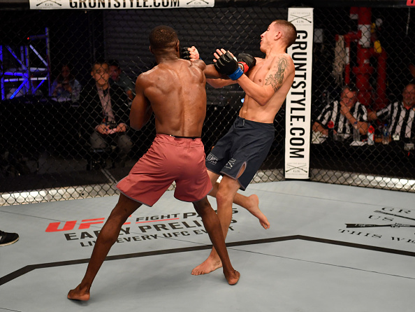 LAS VEGAS, NV - JUNE 12: (L-R) Montel Jackson punches Rico Disciullo in their bantamweight bout during Dana White's Tuesday Night Contender Series at the TUF Gym on June 12, 2018 in Las Vegas, Nevada. (Photo by Jeff Bottari/DWTNCS LLC)
