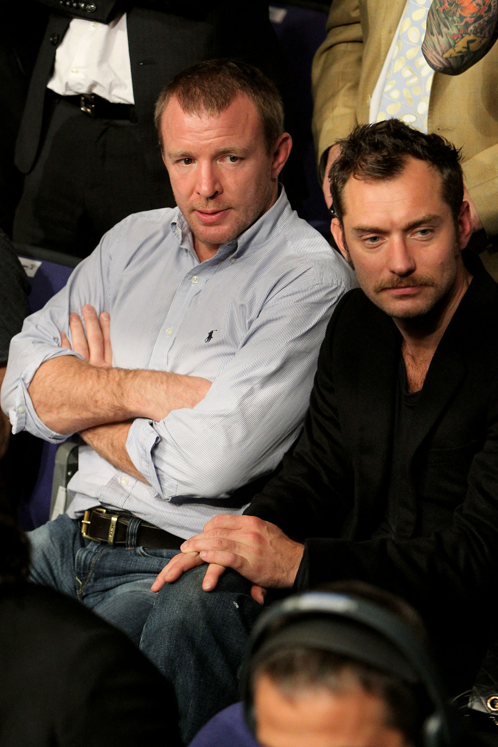 UFC 120: Jude Law(R) and Guy Ritchie(L) watch the main event.