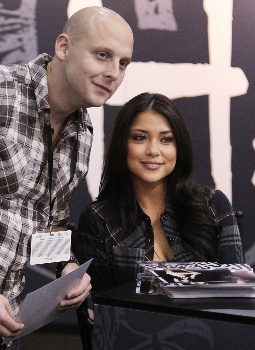 UFC Octagon Girl Arianny Celeste poses for a photo with a fan.