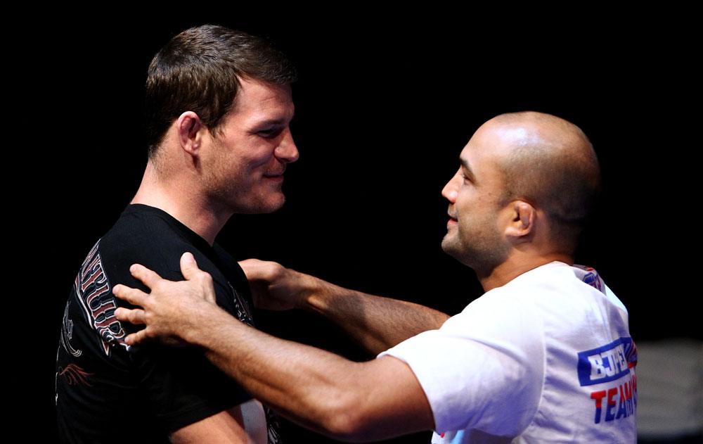 (L to R) Michael Bisping and BJ Penn embrace during an Open Workout