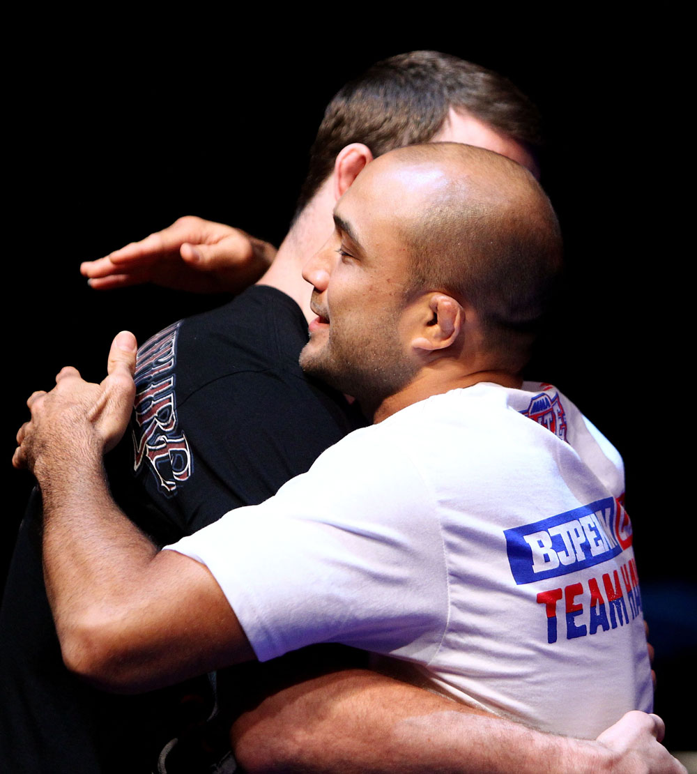 (L to R) Michael Bisping and BJ Penn embrace during an Open Workout