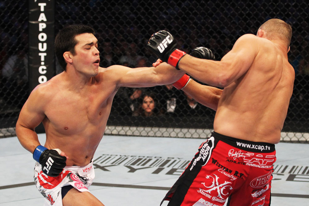 Lyoto Machida (L) hits Randy Couture during their Light Heavyweight bout at UFC 129 in the Rogers Centre on April 30, 2011 in Toronto, Ontario. (Photo by Al Bello/Zuffa LLC)
