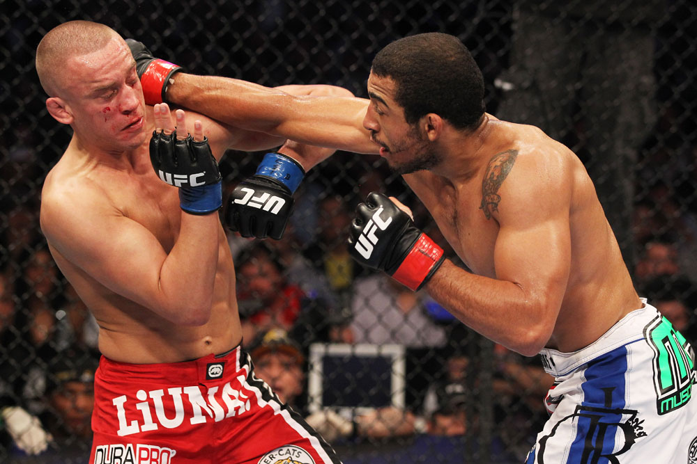 Jose Aldo hits Mark Hominick during their Featherweight Championship bout at UFC 129 in the Rogers Centre on April 30, 2011 in Toronto, ON (Photo by Al Bello/Zuffa LLC)