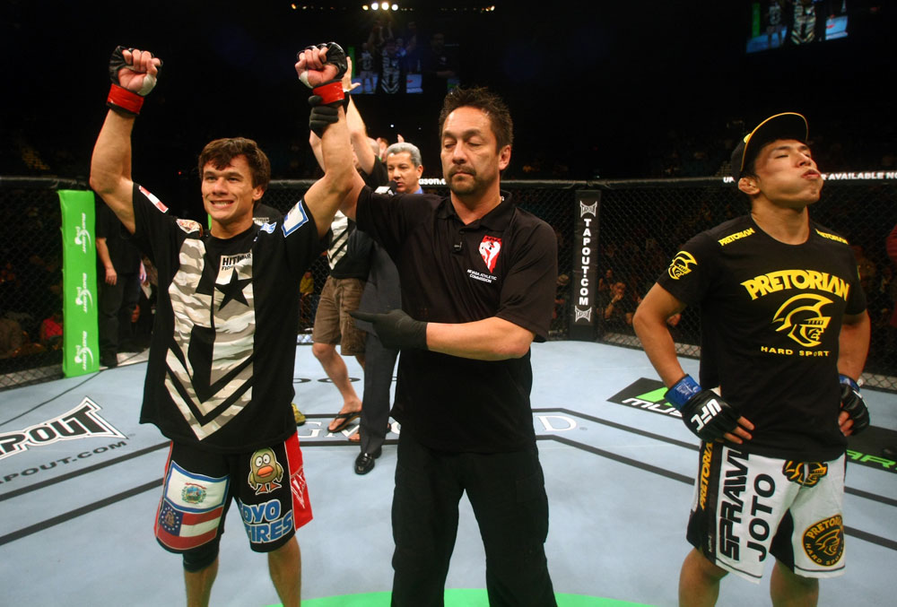 Brian Bowles celebrates after defeating Takeya Mizugaki.