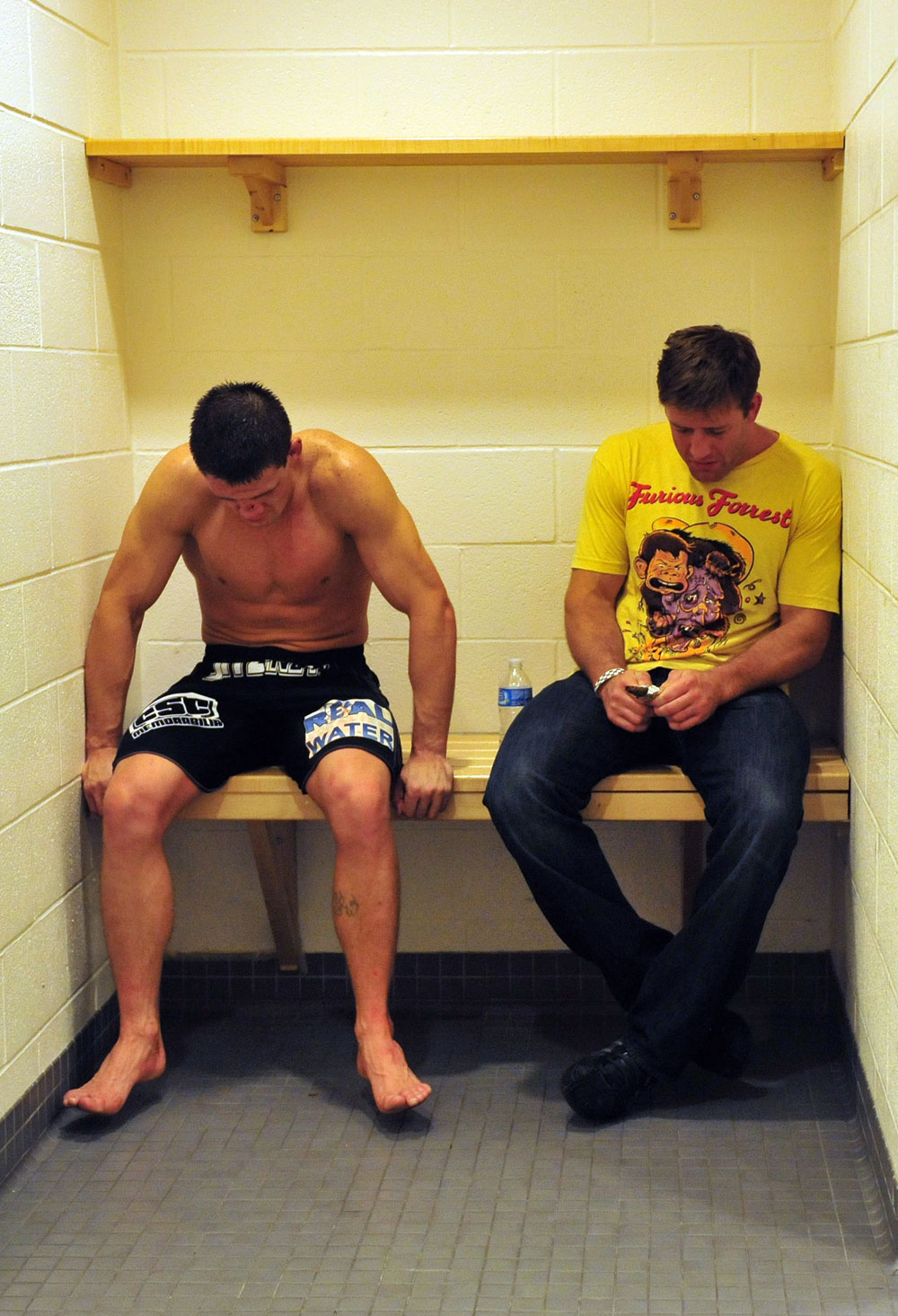 A disappointed Steve Cantwell sis in a corner in his dressing room with teammate Stephan Bonnar after his loss to Mike Massenzio