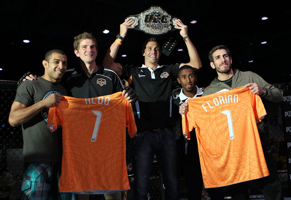 (L-R) UFC Featherweight Champion Jose Aldo, Houston Dynamo defender Bobby Boswell, Houston Dynamo midfielder Geoff Cameron, Houston Dynamo defender Corey Ashe, and UFC Featherweight title challenger Kenny Florian