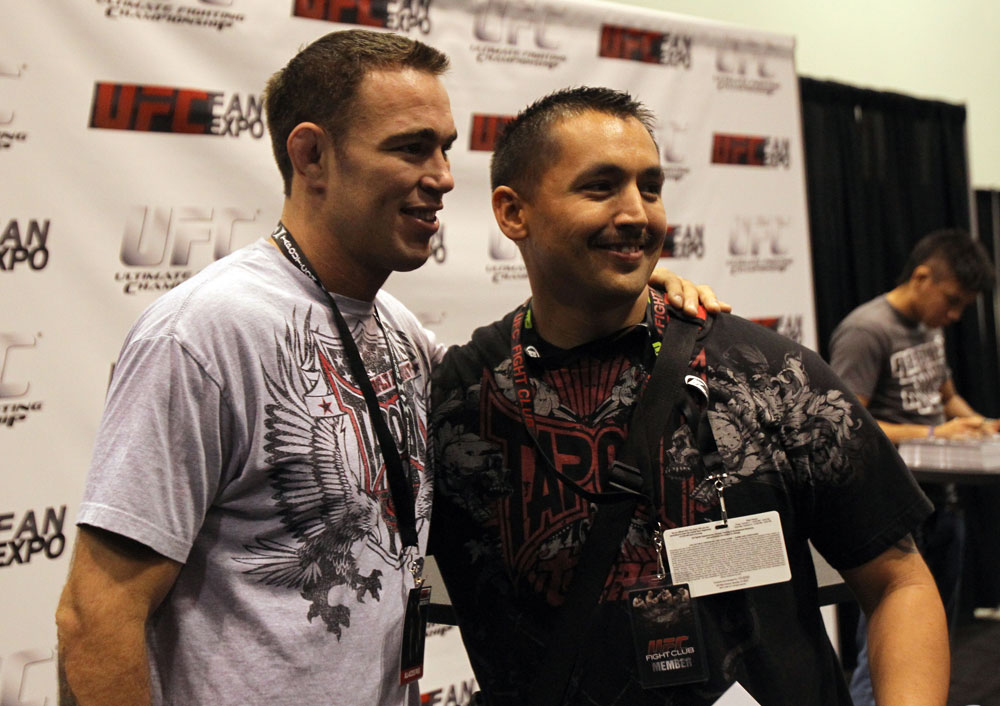 Jake Shields poses for a photo for a fan