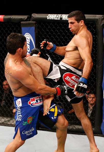 Beneil Dariush knees <a href='../fighter/Carlos-Diego-Ferreira'>Diego Ferreira</a> of Brazil in their lightweight bout during the UFC 179 event at Maracanazinho on October 25, 2014 in Rio de Janeiro, Brazil. (Photo by Josh Hedges/Zuffa LLC)