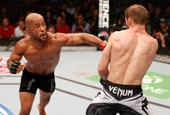 Demetrious Johnson delivers a punch against Ali Bagautinov in their UFC flyweight bout on 6/14/14 in Vancouver, Canada. (Photo by Josh Hedges/Zuffa LLC)