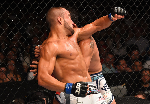 MEXICO CITY, MEXICO - JUNE 13: (L-R) Eddie Alvarez of the United States throws a spinning back elbow at Gilbert Melendez of the United States in their lightweight bout during the UFC 188 event at the Arena Ciudad de Mexico. (Photo by Josh Hedges/Zuffa LLC)