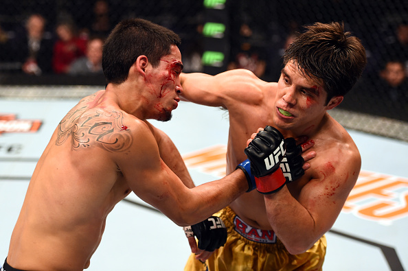 PHOENIX, AZ - DECEMBER 13: (R-L) Henry Cejudo punches <a href='../fighter/Dustin-Kimura'>Dustin Kimura</a> in their bantamweight fight during the <a href='../event/UFC-Silva-vs-Irvin'><a href='../event/saturday-august-23'><a href='../event/saturday-september-19'><a href='../event/saturday-september-26'><a href='../event/tbd-october'><a href='../event/saturday-november-7'><a href='../event/saturday-november-21'><a href='../event/saturday-december-12'><a href='../event/saturday-december-19'>UFC Fight Night </a></a></a></a></a></a></a></a></a>event at the U.S. Airways Center. (Photo by Josh Hedges/Zuffa LLC)