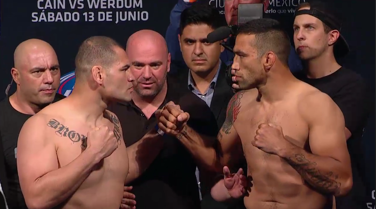 <a href='../fighter/Fabricio-Werdum'>Fabricio Werdum</a> and <a href='../fighter/Cain-Velasquez'>Cain Velasquez</a> face off at the UFC 188 weigh-in before their heavyweight title fight