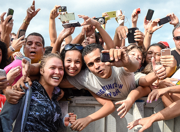 Ronda Rousey takes photos with fans during open training session. (Buda Mendes/Zuffa LLC)