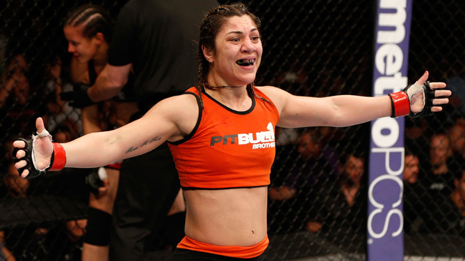 Correia celebrates after her TKO victory over Shayna Baszler in their women's bantamweight bout during UFC 177. (Josh Hedges/Zuffa LLC)