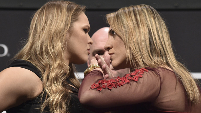 Rousey and Correia face off as UFC President Dana White (C) stands in during the 189 World Media Tour Launch press conference. (Buda Mendes/Zuffa LLC)