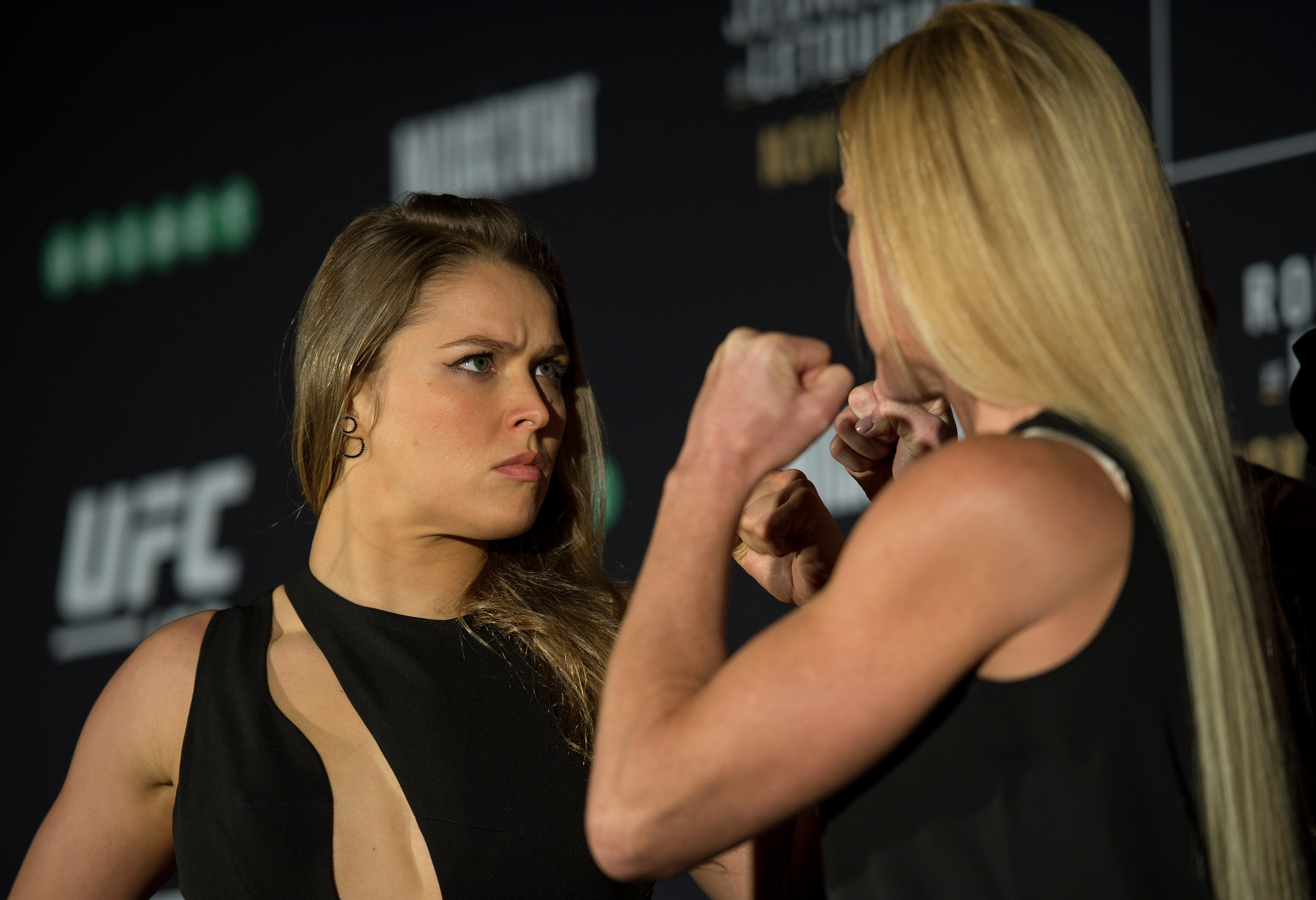 MELBOURNE, AUSTRALIA - NOVEMBER 13: (L-R) UFC women's bantamweight champion Ronda Rousey of the United States and Holly Holm of the United States face off during the UFC 193 Ultimate Media Day festivities at Etihad Stadium on November 13, 2015 in Melbourne, Australia. (Photo by Brandon Magnus/Zuffa LLC)