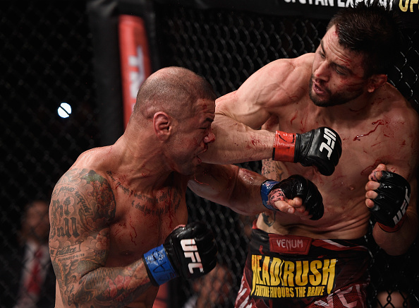 Carlos Condit of the United States punches Thiago Alves of Brazil in their welterweight UFC bout during the UFC Fight Night event at Arena Goiania on May 30, 2015 in Goiania, Brazil.(Buda Mendes/Zuffa LLC)