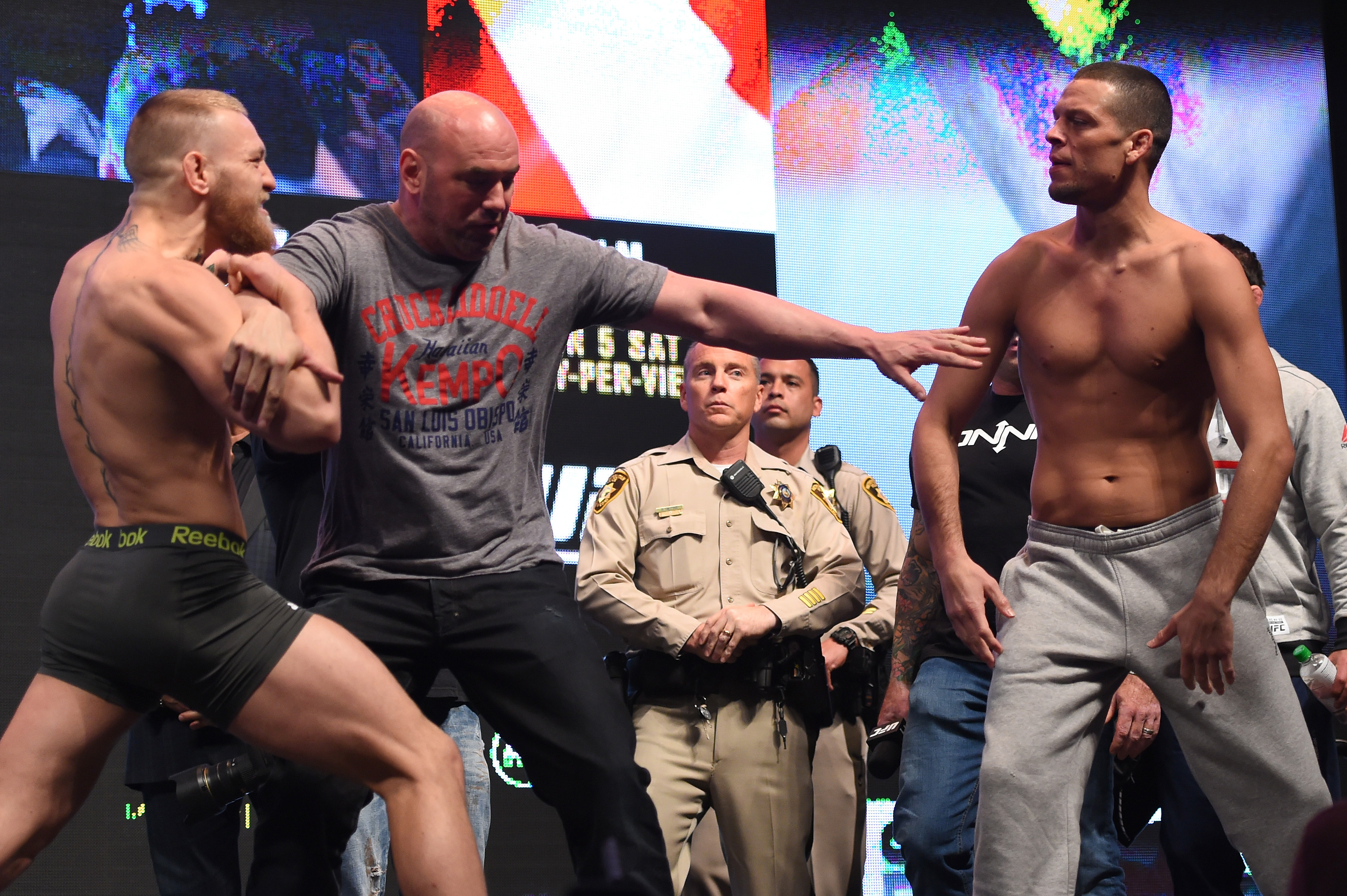 (L-R) Opponents Conor McGregor of Ireland and Nate Diaz face off during the UFC 196 Weigh-in at the MGM Grand Garden Arena on March 4, 2016 in Las Vegas, Nevada. (Photo by Josh Hedges/Zuffa LLC)