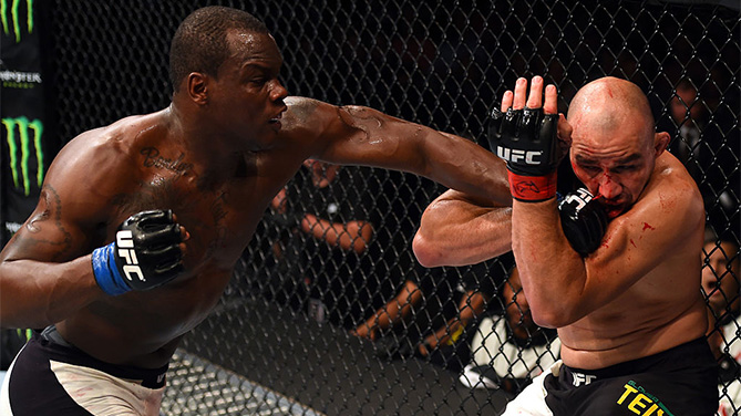 (L-R) Ovince Saint Preux punches Glover Teixeira of Brazil in their light heavyweight bout during the UFC Fight Night event at Bridgestone Arena on August 8, 2015 in Nashville, Tennessee. (Photo by Josh Hedges/Zuffa LLC)