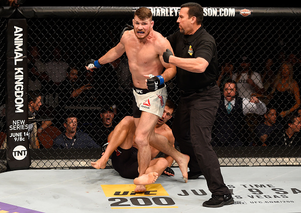 INGLEWOOD, CA - JUNE 04: <a href='../fighter/Michael-Bisping'>Michael Bisping</a> of England wins in a first round knockout against Luke Rockhold in their UFC middleweight championship bout during the UFC 199 event at The Forum. (Photo by Josh Hedges/Zuffa LLC)