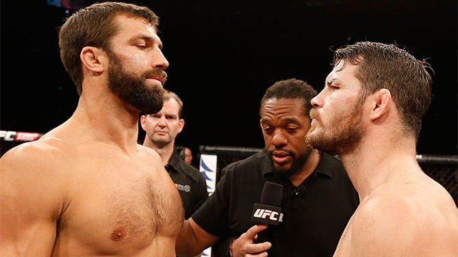 SYDNEY, NSW - NOVEMBER 08: (L-R) Opponents <a href='../fighter/Luke-Rockhold'>Luke Rockhold</a> of the United States and <a href='../fighter/Michael-Bisping'>Michael Bisping</a> of England face off before their middleweight bout during the <a href='../event/UFC-Silva-vs-Irvin'>UFC Fight Night </a>event inside Allphones Arena on November 8, 2014 in Sydney, Australia. (Photo by Josh Hedges/Zuffa LLC)