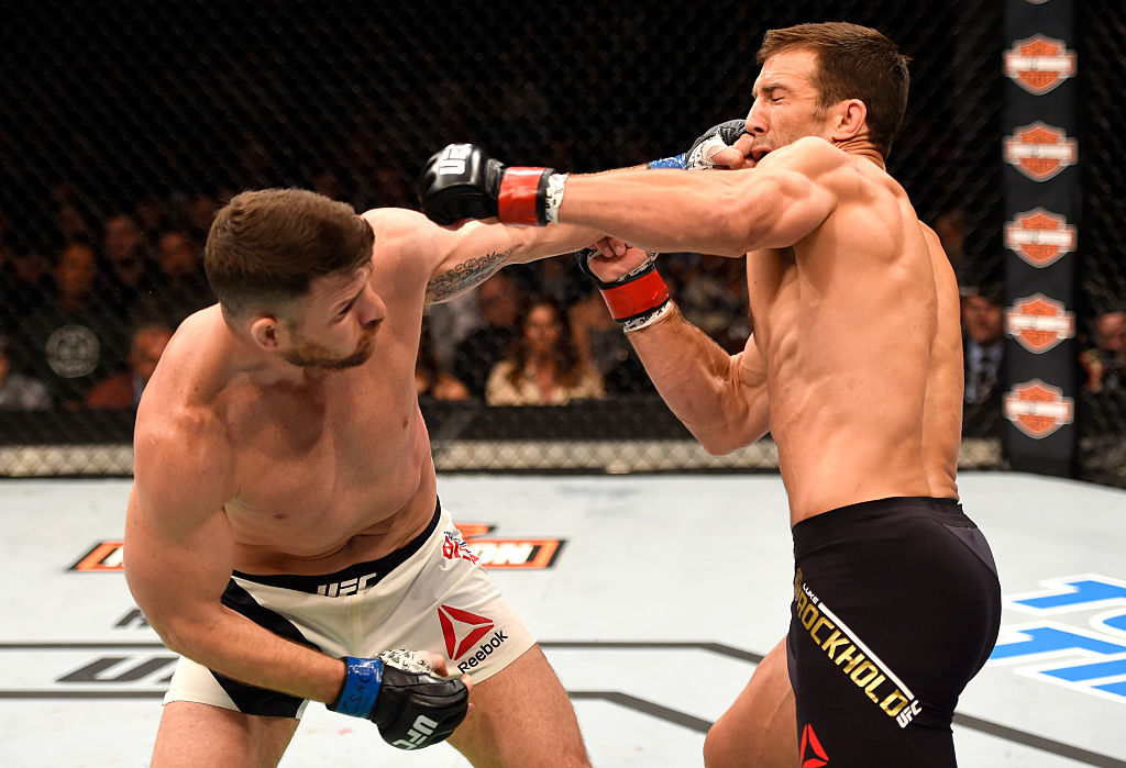 INGLEWOOD, CA - JUNE 04: Michael Bisping throws a left punch against Luke Rockhold in their UFC middleweight championship bout during the UFC 199 event at The Forum. (Photo by Josh Hedges/Zuffa LLC)