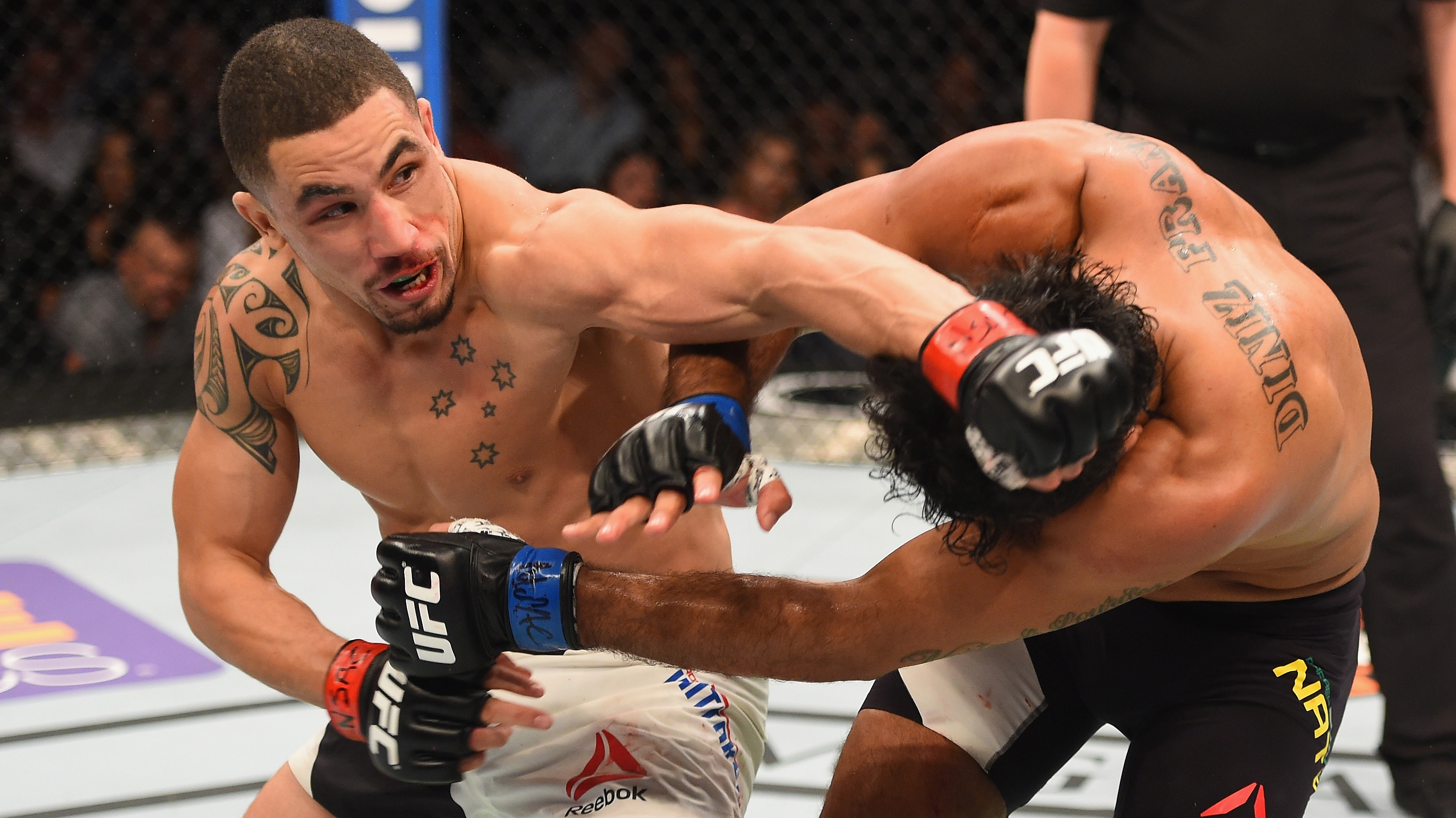 Robert Whittaker punches <a href='../fighter/rafael-natal'><a href='../fighter/rafael-natal'>Rafael Natal</a></a> during his most recent win at UFC 197