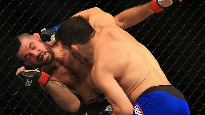 ATLANTA, GA - JULY 30: (R-L) Jake Ellenberger punches Matt Brown in their welterweight bout during the UFC 201 event on July 30, 2016. (Photo by Daniel Shirey/Zuffa LLC)