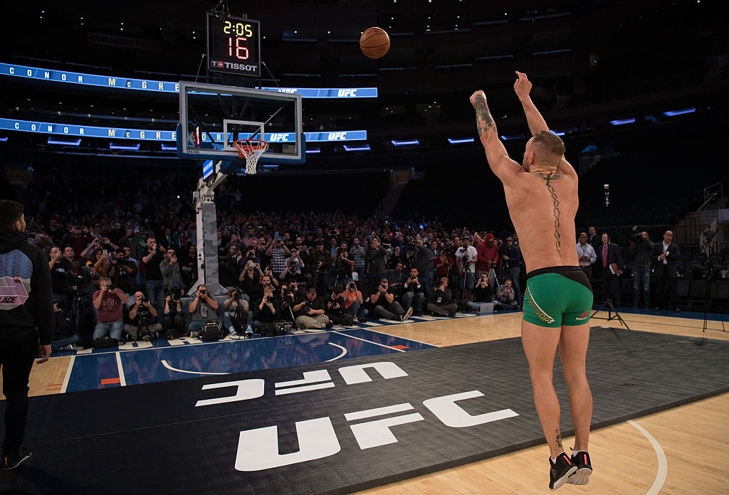 NEW YORK, NY - NOVEMBER 09: UFC featherweight champion Conor McGrregor of Ireland shoots from the free throw line during an open training session for the media and fans inside Madison Square Garden. (Photo by Brandon Magnus/Zuffa LLC)