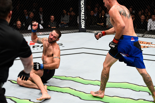 Donald Cerrone knocks out Matt Brown with a kick to the head in their welterweight bout during the UFC 206