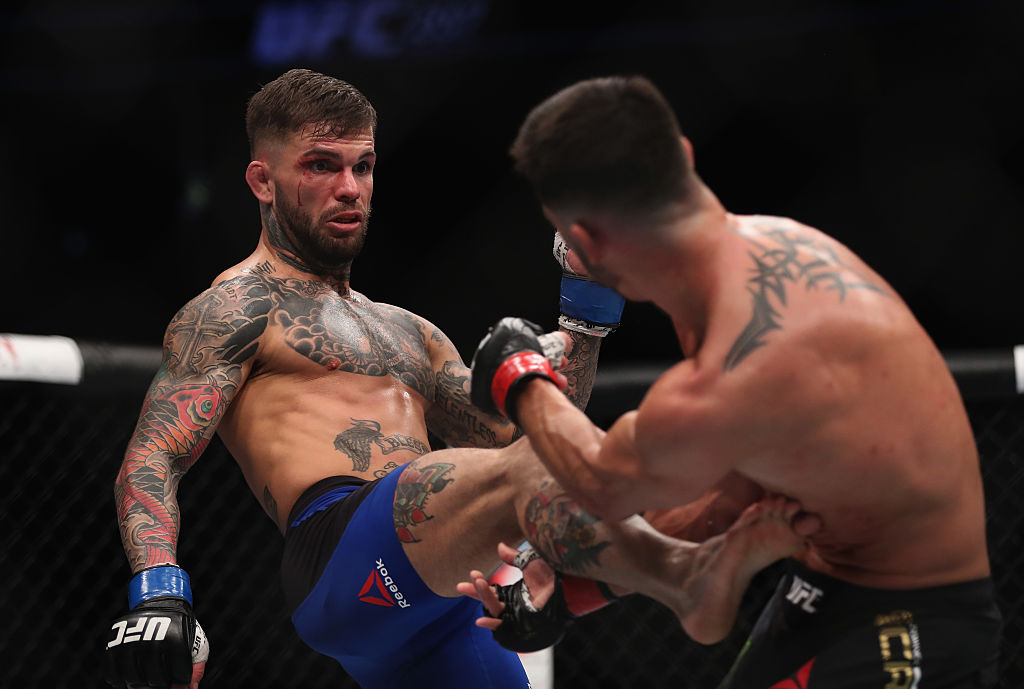 Cody Garbrandt kicks Dominick Cruz in their UFC bantamweight championship bout during UFC 207 (Photo by Christian Petersen/Getty Images)