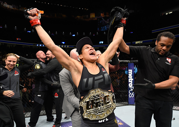 Amanda Nunes celebrates after her victory over Ronda Rousey to defend the women's bantamweight title