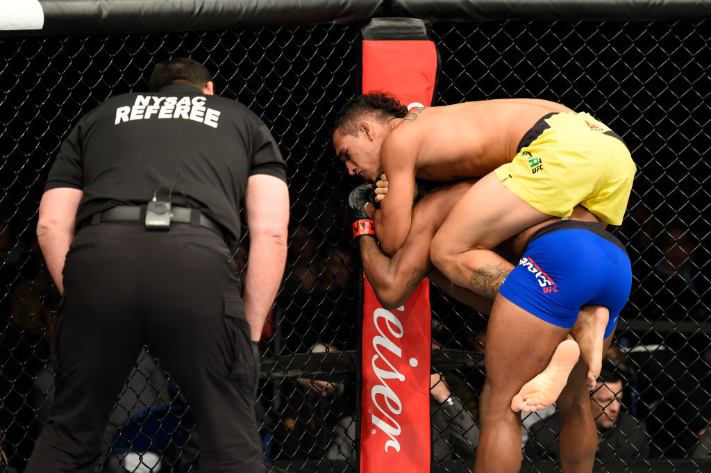 BUFFALO, NY - APRIL 08: Charles Oliveira secures a rear choke submission victory against Will Brooks in their lightweight bout during the UFC 210 event at KeyBank Center on April 8, 2017 in Buffalo, New York. (Photo by Josh Hedges/Zuffa LLC)