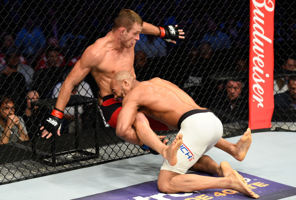 DALLAS, TX - MAY 13: (R-L) David Branch takes down Krzysztof Jotko in their middleweight fight during the UFC 211 event at the American Airlines Center on May 13, 2017 in Dallas, Texas. (Photo by Josh Hedges/Zuffa LLC)