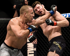 Georges St-Pierre of Canada punches Michael Bisping of England in their UFC middleweight championship bout during the UFC 217 event inside Madison Square Garden on November 4, 2017 in New York City. (Photo by Brandon Magnus/Zuffa LLC)