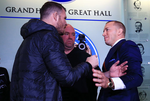 <a href='../fighter/Michael-Bisping'>Michael Bisping</a> and <a href='../fighter/Georges-St-Pierre'>Georges St-Pierre</a> face off following the UFC 217 press conference with Dana White at the Hockey Hall of Fame on October 13, 2017 in Toronto, Canada. (Photo by Vaughn Ridley/Zuffa LLC)