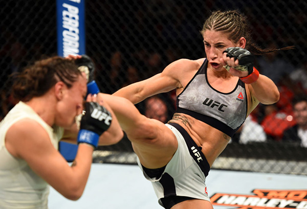 <a href='../fighter/Tecia-Torres'>Tecia Torres</a> kicks <a href='../fighter/michelle-waterson'>Michelle Waterson</a> in their women's strawweight bout during the UFC 218 event inside Little Caesars Arena on December 02, 2017 in Detroit, Michigan. (Photo by Josh Hedges/Zuffa LLC)