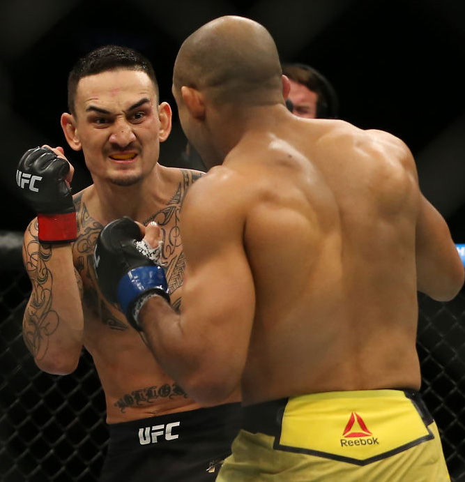 (R) <a href='../fighter/Jose-Aldo'&gtJose Aldo</a> punches <a href='../fighter/Max-Holloway'&gtMax Holloway</a> during UFC 218 on December 2, 2017 in Detroit, Michigan. (Photo by Rey Del Rio/Zuffa LLC)